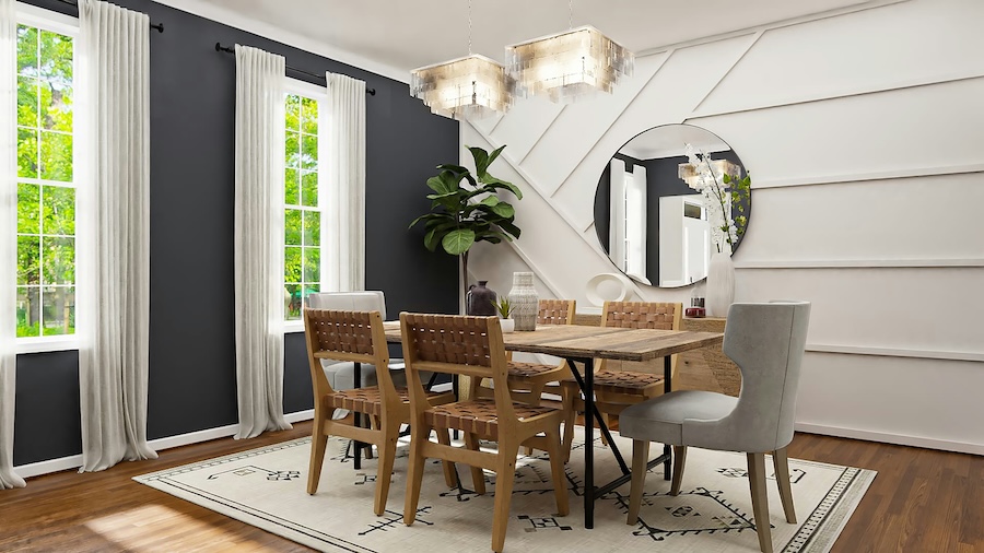 Dining room with wooden table, woven chairs, geometric accent wall, round mirror, and twin chandeliers